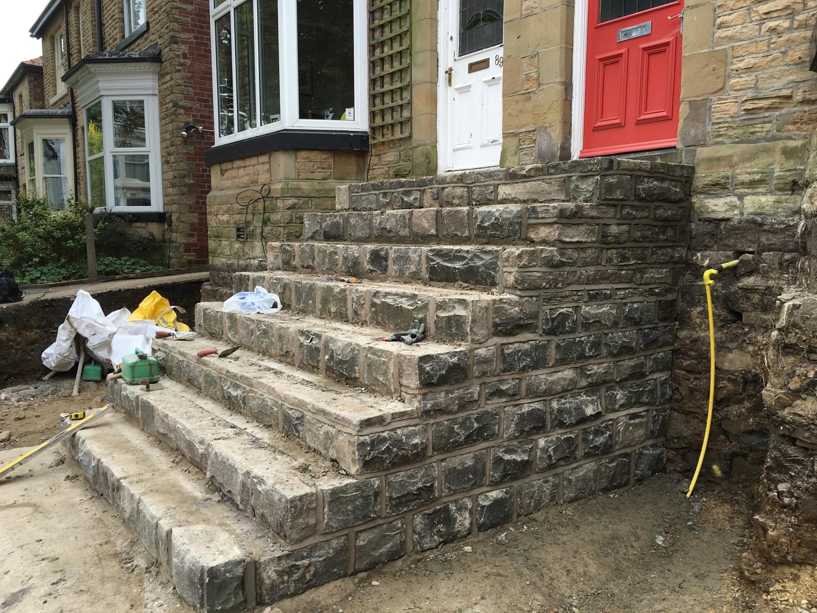 Stone entrance steps built outside a property